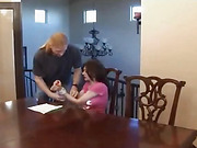 A BDSM scene with a slut who is tied up and gagged while