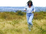 A sexy German lady getting her tits sprayed outdoors