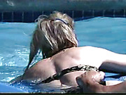 Poolside spanking scene with two wet babes