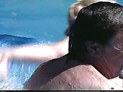 Poolside spanking scene with two wet babes